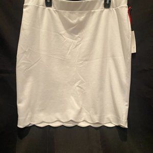 Elle, white, scalloped skirt.